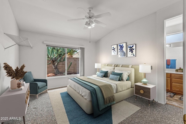 bedroom featuring connected bathroom, a ceiling fan, and lofted ceiling