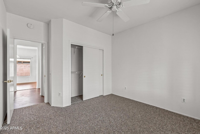 unfurnished bedroom featuring a closet and carpet floors