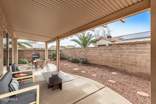 view of patio / terrace with outdoor dining space and a fenced backyard