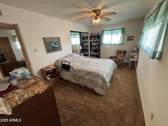 carpeted bedroom with ceiling fan