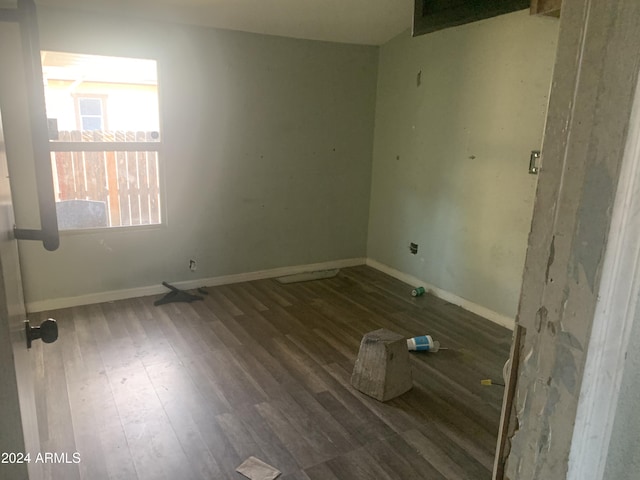 empty room with dark wood-type flooring