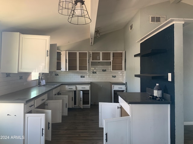 kitchen featuring backsplash, white cabinets, lofted ceiling with beams, sink, and dark hardwood / wood-style flooring