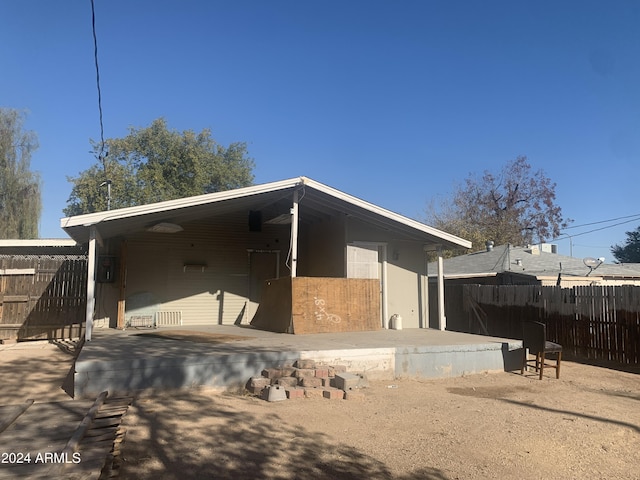 back of house with a patio area