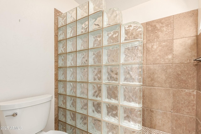 bathroom with walk in shower and toilet