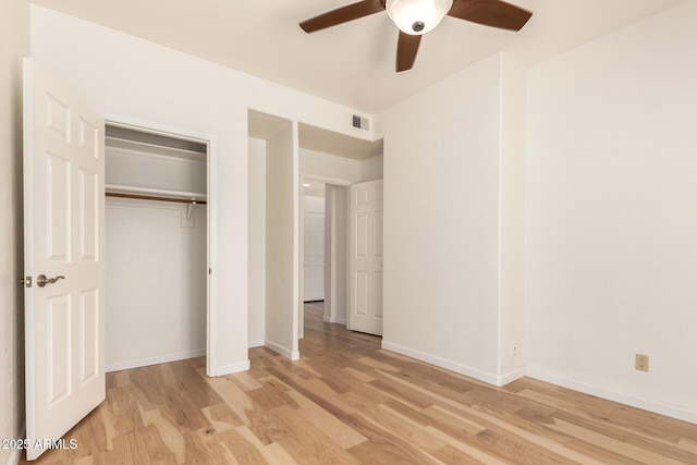 unfurnished bedroom featuring baseboards, light wood-style flooring, and visible vents