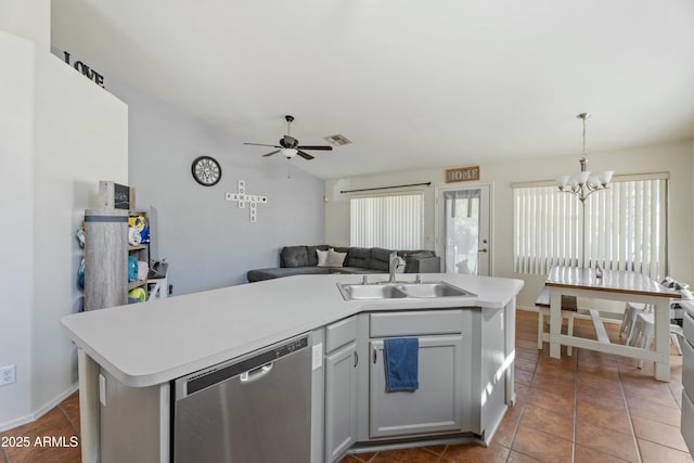 kitchen featuring visible vents, open floor plan, dishwasher, light countertops, and a sink