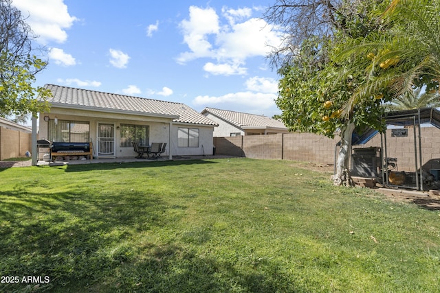 view of yard with a patio area and a fenced backyard