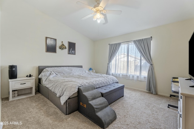 bedroom featuring vaulted ceiling, a ceiling fan, baseboards, and carpet floors