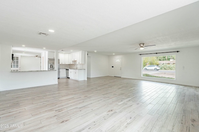 3743 E Coronado Rd, Phoenix, AZ 85008 - unfurnished living room featuring recessed lighting, visible vents, ceiling fan, light wood finished floors, and a sink