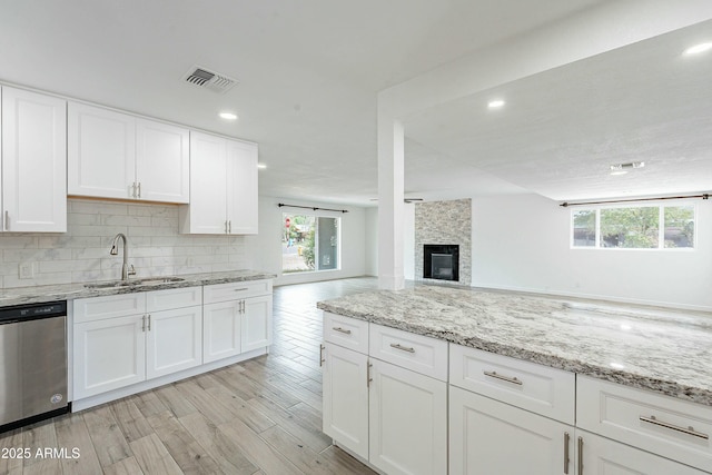 3743 E Coronado Rd, Phoenix, AZ 85008 - kitchen with stainless steel dishwasher, plenty of natural light, visible vents, and a sink