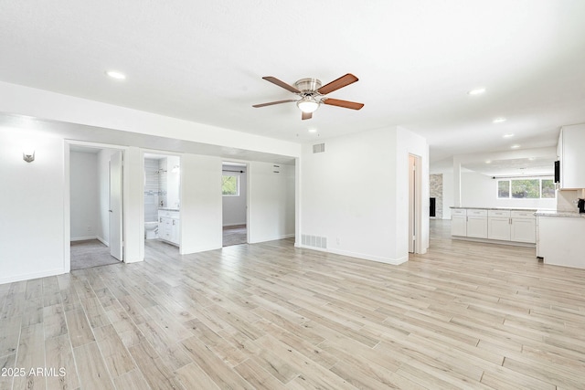 3743 E Coronado Rd, Phoenix, AZ 85008 - unfurnished living room featuring light wood-style flooring, ceiling fan, visible vents, and recessed lighting