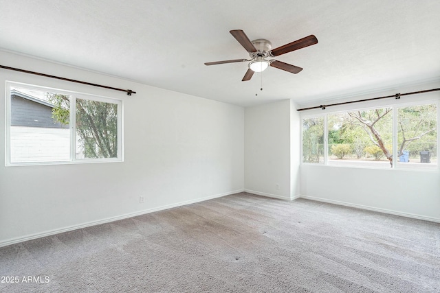 3743 E Coronado Rd, Phoenix, AZ 85008 - carpeted spare room featuring baseboards, a ceiling fan, and a healthy amount of sunlight