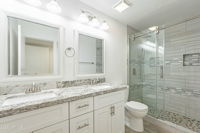 3743 E Coronado Rd, Phoenix, AZ 85008 - full bathroom with a sink, toilet, a shower stall, and double vanity