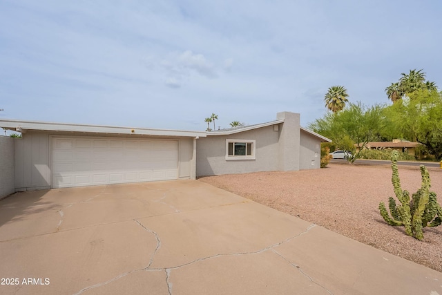 3743 E Coronado Rd, Phoenix, AZ 85008 - view of front of property featuring concrete driveway, stucco siding, and an attached garage