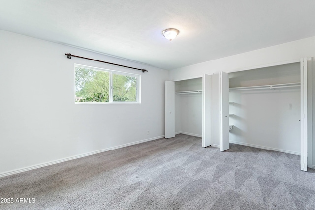 3743 E Coronado Rd, Phoenix, AZ 85008 - unfurnished bedroom featuring baseboards, two closets, and carpet floors
