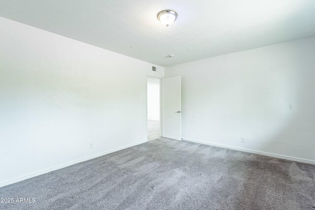 3743 E Coronado Rd, Phoenix, AZ 85008 - empty room with visible vents, baseboards, and carpet
