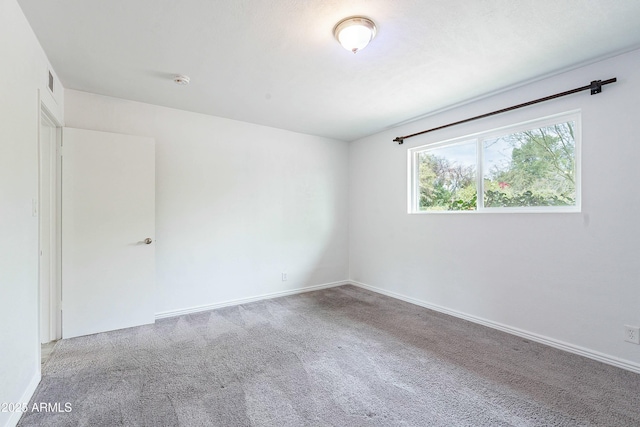 3743 E Coronado Rd, Phoenix, AZ 85008 - spare room with visible vents, baseboards, and carpet