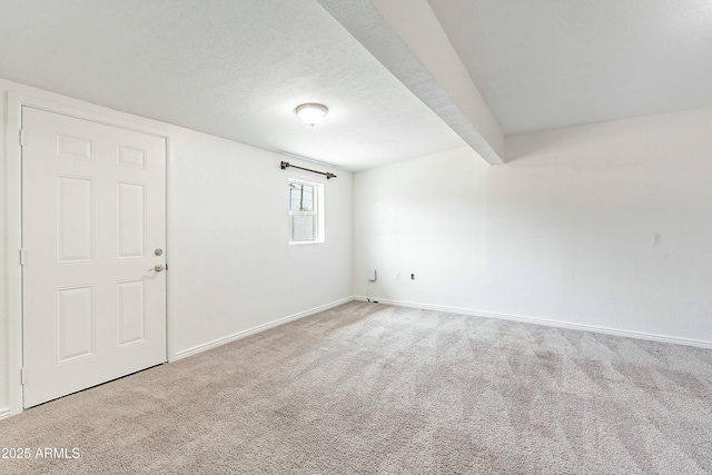 3743 E Coronado Rd, Phoenix, AZ 85008 - empty room with carpet, baseboards, and beamed ceiling