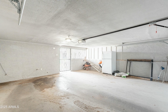 3743 E Coronado Rd, Phoenix, AZ 85008 - garage featuring a garage door opener and freestanding refrigerator