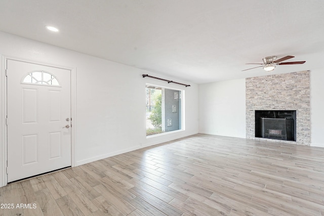 3743 E Coronado Rd, Phoenix, AZ 85008 - unfurnished living room with baseboards, a ceiling fan, a fireplace, recessed lighting, and light wood-style flooring