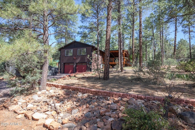 8894 W Lufkin Dr, Pine, AZ 85544 - back of house with driveway and an attached garage