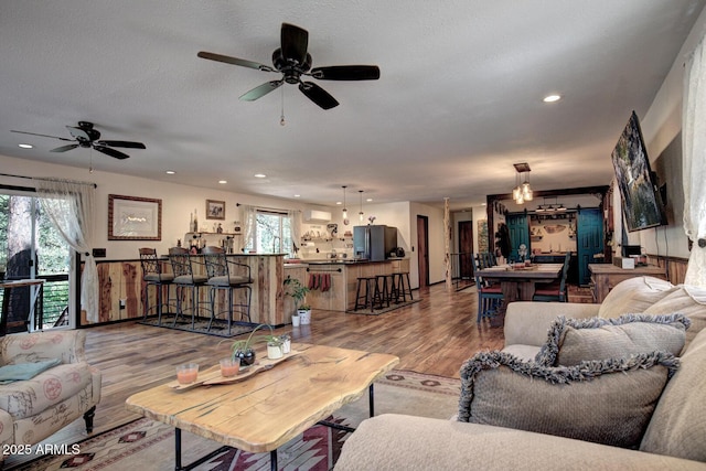 8894 W Lufkin Dr, Pine, AZ 85544 - living room with wood finished floors, plenty of natural light, a ceiling fan, and recessed lighting