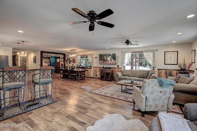 8894 W Lufkin Dr, Pine, AZ 85544 - living room featuring light wood-style flooring, a ceiling fan, recessed lighting, and a chandelier