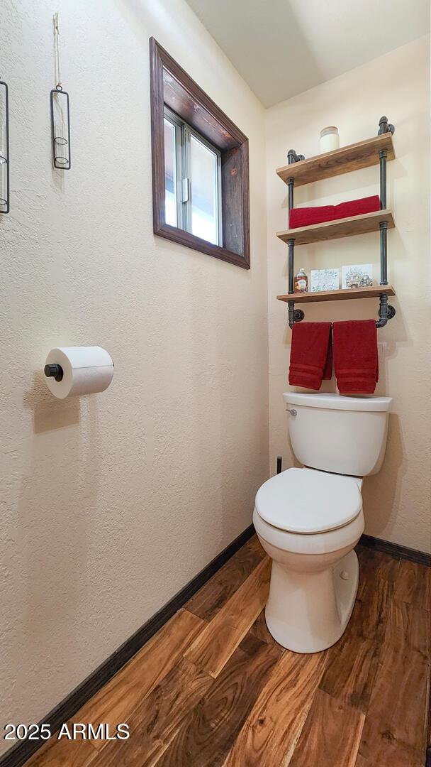 8894 W Lufkin Dr, Pine, AZ 85544 - bathroom with wood finished floors and baseboards