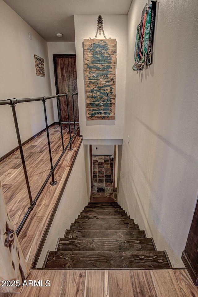 8894 W Lufkin Dr, Pine, AZ 85544 - stairway with wood finished floors