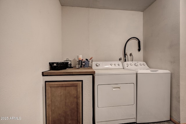 8894 W Lufkin Dr, Pine, AZ 85544 - laundry room featuring washing machine and clothes dryer and cabinet space
