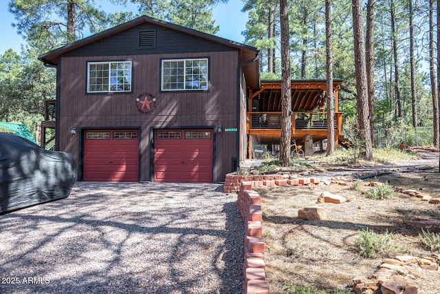 8894 W Lufkin Dr, Pine, AZ 85544 - chalet / cabin featuring a garage and driveway