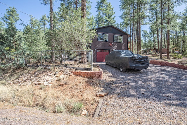 8894 W Lufkin Dr, Pine, AZ 85544 - chalet / cabin featuring an attached garage and driveway