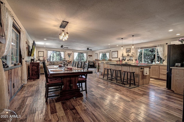 8894 W Lufkin Dr, Pine, AZ 85544 - dining area with ceiling fan, dark wood-style flooring, recessed lighting, and a textured ceiling