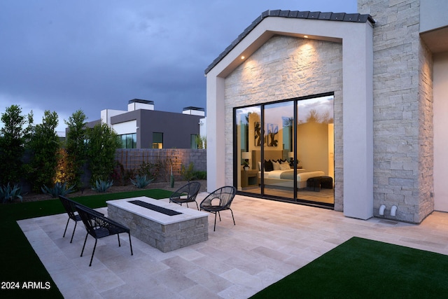 view of patio / terrace with a fire pit