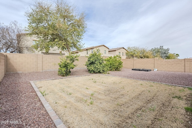 view of yard featuring a fenced backyard