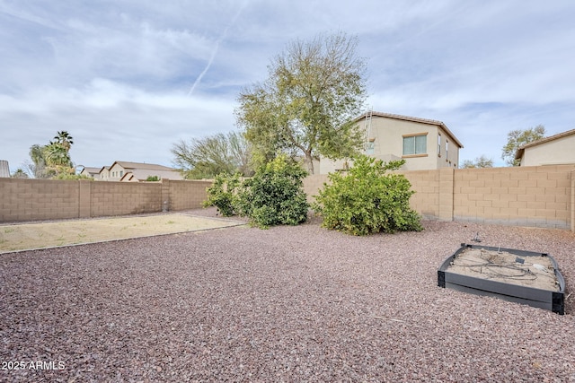 view of yard with a patio area and a fenced backyard