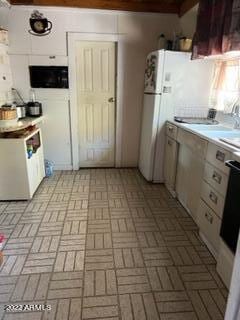 kitchen featuring white cabinets