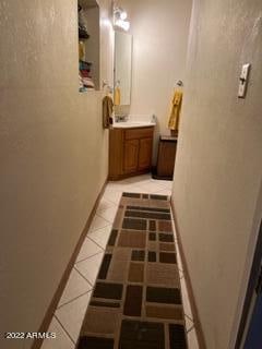 hallway featuring light tile floors