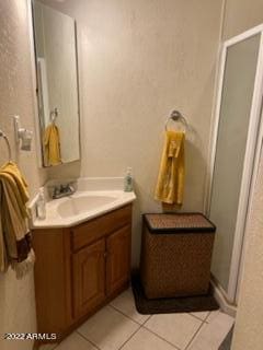 bathroom featuring vanity and tile flooring