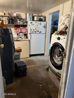 clothes washing area featuring washer / clothes dryer