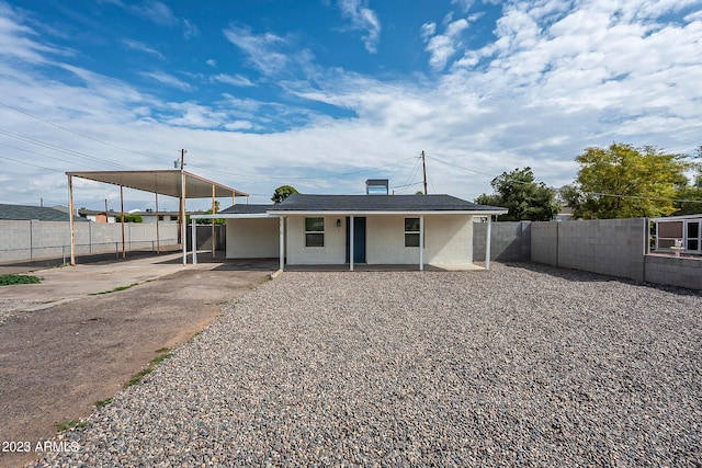 back of house with a patio area