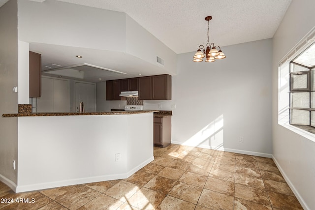 kitchen featuring a textured ceiling, decorative light fixtures, dark brown cabinets, a chandelier, and range