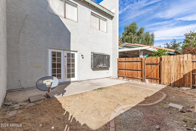 back of house with a patio and french doors