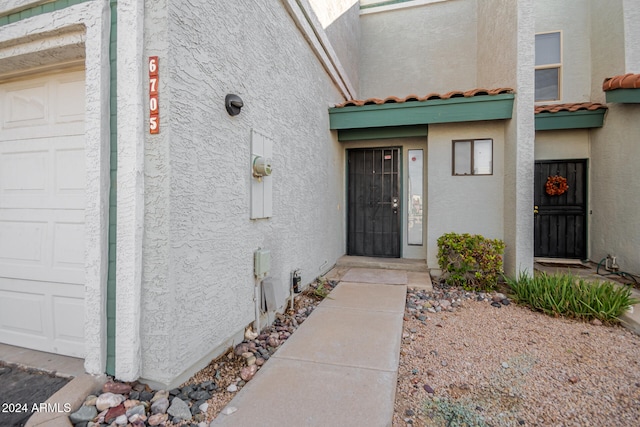 property entrance featuring a garage