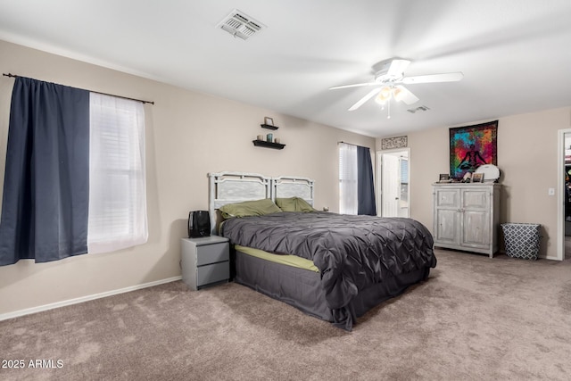 bedroom with carpet floors, baseboards, ceiling fan, and visible vents