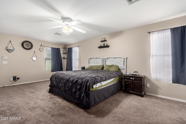 bedroom with carpet flooring, a ceiling fan, baseboards, and visible vents