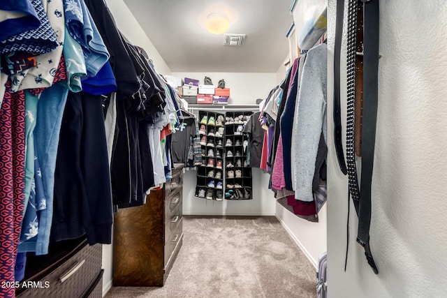 spacious closet with visible vents and carpet floors