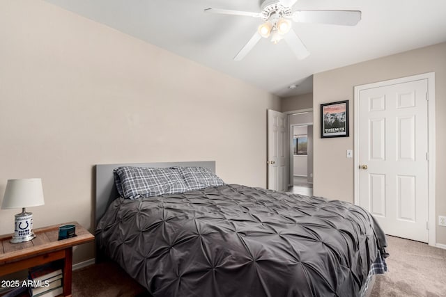 carpeted bedroom with baseboards and ceiling fan