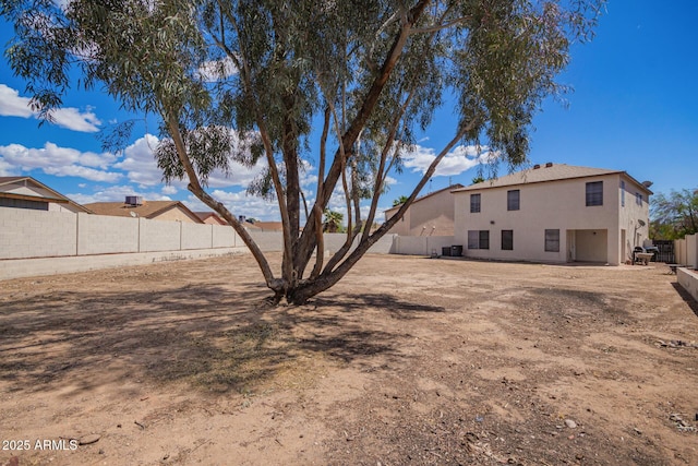 view of yard featuring a fenced backyard and cooling unit