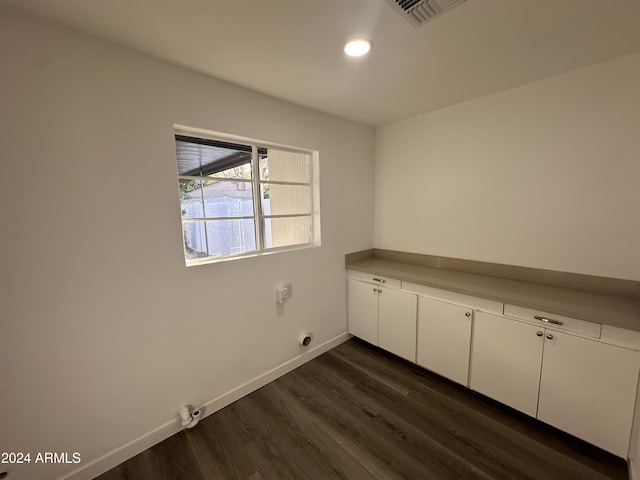 empty room featuring dark wood-type flooring